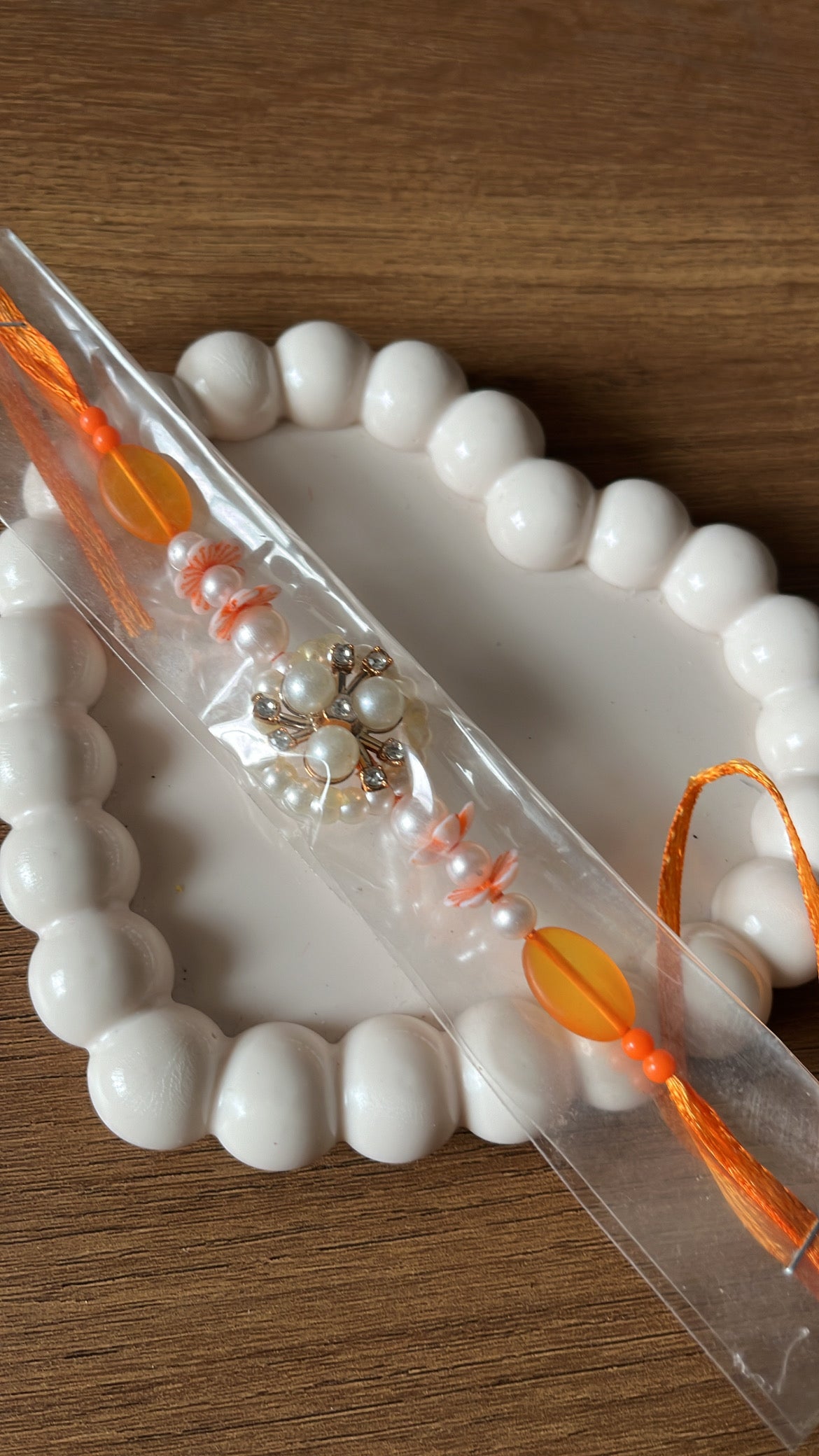 Orange Pearl AD Rakhi