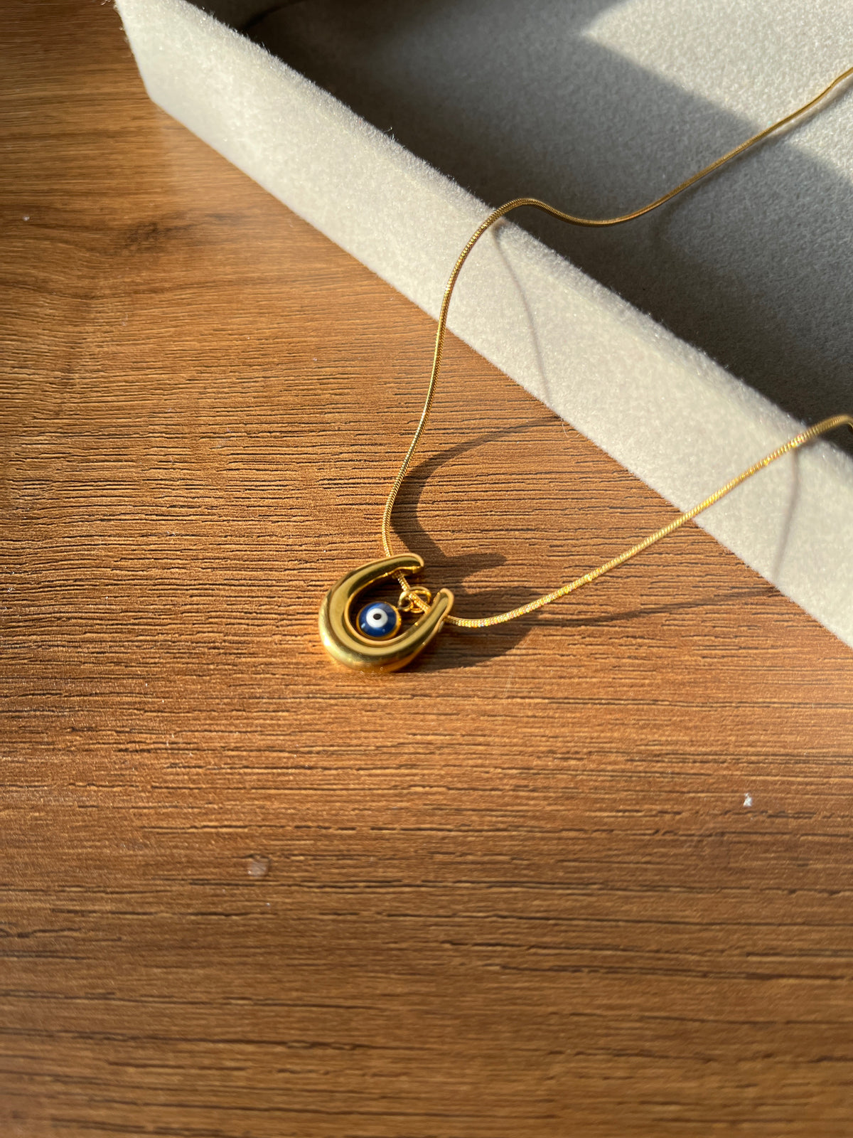 Evil eye U pendant